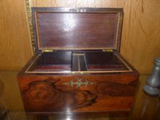 A Georgian rosewood tea caddy with brass