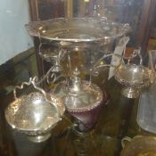 A silver plated epergne with three hanging basket with reticulated floral decoration