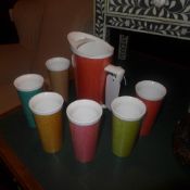 A 1950's water jug and the matching six cups