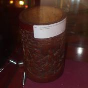 A Chinese bamboo brush pot with landscapes and figures in relief