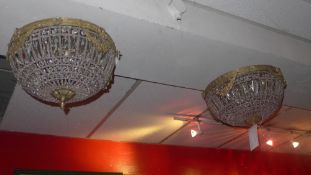 A pair of gilt metal and cut glass basket form ceiling lights