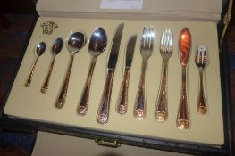 A cased canteen of Versaille gold and silver plated cutlery
