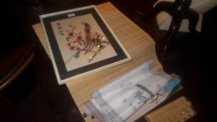 A glazed and framed Chinese embroided silk together with some Chinese scrolls