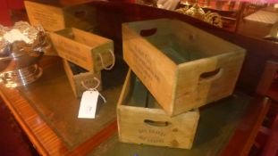 A collection of six stained pine vegetable boxes of different size