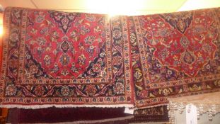 Two fine central Persian Kashan rugs  150 x 100 cm, 145 x 100 cm bearing central floral pendant