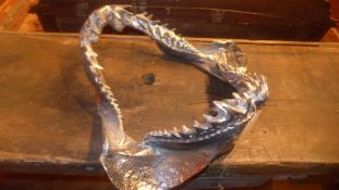 A pair of aluminium wall mounted model sharks jaws