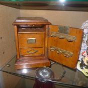 A Victorian oak smoker's companion with brass detail
