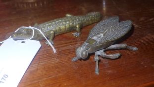 A brass ashtray in the form of a crocodile and a similar fly form ashtray