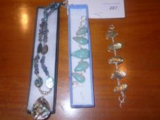 An abalone mother of pearl and silver necklace together with a similar bracelet and an amazonite and