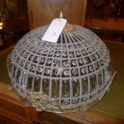 A pair of large gilt metal and cut glass basket form ceiling lights