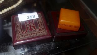 A Chinese soapstone seal in a carved hardwood box