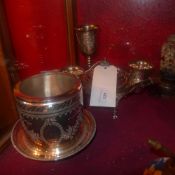 A silver plated biscuit barrel with engraved detail together with a similar serving set and goblet