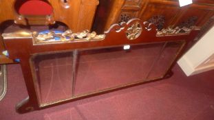 A C19th mahogany and giltwood overmantle mirror with fret cut detail and three bevelled plates