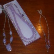 A collection of sterling silver amethyst and agate jewellery including necklaces and earrings