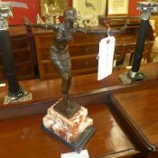 An Art Deco style bronze of a lady dancer on marble stand
