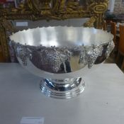 A large  silver plated punch bowl with grape decoration
