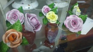 A collection of six Herand porcelain roses, all marked to base