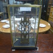 A skeleton clock within glass case
