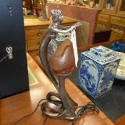 An Art Deco style lamp with shell shade