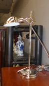 A chrome adjustable desk lamp