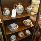 A Japanese egg shell tea service comprising teapot, jug bowl cups and saucers