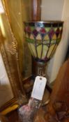 A bronzed Art Deco style lamp with lady shade