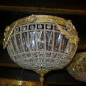 A pair of cut glass and brass ceiling lights