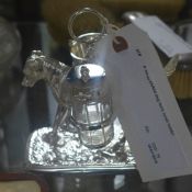 A silver plated dog form cruet holder