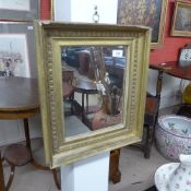 A small C19th giltwood oak mirror the rectangular plate within a moulded and leaf decorated frame