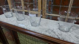 A set of four Louis Roederer glass ice buckets