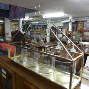 A gilded storm lantern with four glass bowls
