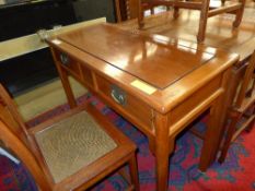 A Chinese hardwood dressing/side table with two drawers on tapered support