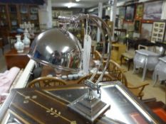 A chromium crescent form table lamp