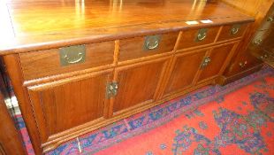 A Chinese hardwood sideboard having drawers above cupboard