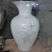 A large Limoges porcelain vase with floral design