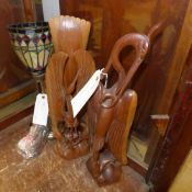 A pair of similar carved wooden birds
