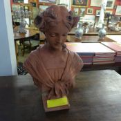A simulated terracotta bust of a maiden