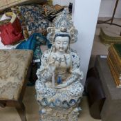 An Oriental porcelain model of a deity