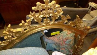 A French overmantel mirror the carved crest with shaped plate