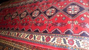 An extremely fine South West Persian Qashgai runner repeating pole medallion with petal and animal