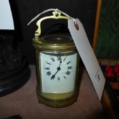 A late C19th French oval carriage clock