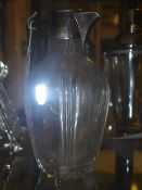 A silver mounted Claret jug in Art Nouve