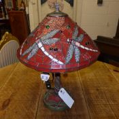 A Tiffany lamp with dragonfly shade