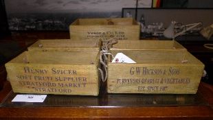 A set of five wooden imprinted storage b