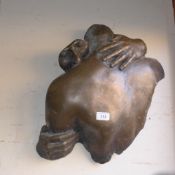 A bronzed modern sculpture ''The Embrace''