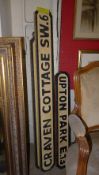 A set of three wooden street signs