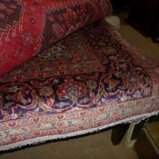 An extremely fine central Persian Kashan carpet central sapphire floral medallion with repeating