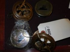 A set of four assorted compasses