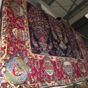 A fine North East Persian Meshad carpet repeating tree of life design on a sapphire field guarded by