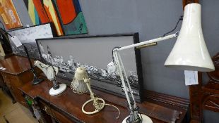 A black painted angle poise lamp togethe